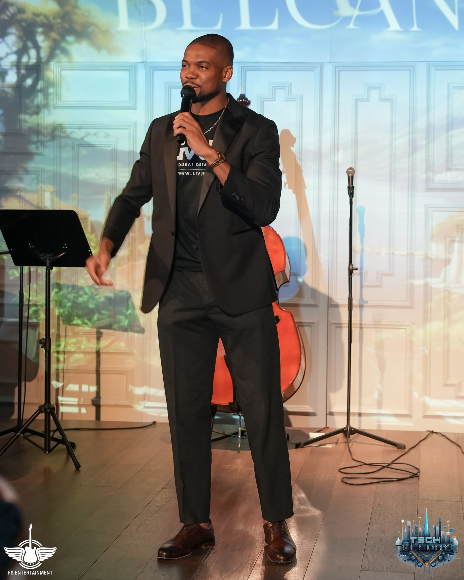 Tonye Anyanwu speaking into a microphone on stage