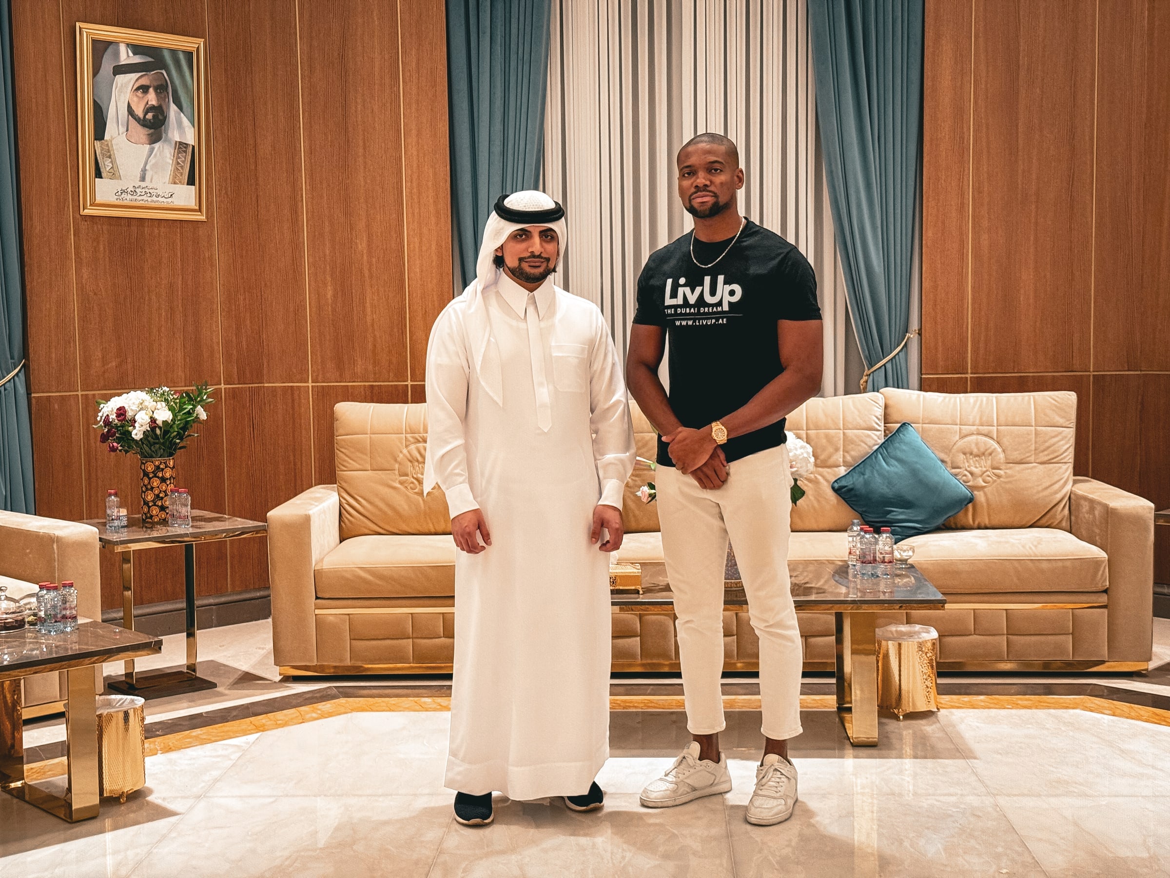 Tonye Anyanwu standing with a UAE official during a meeting